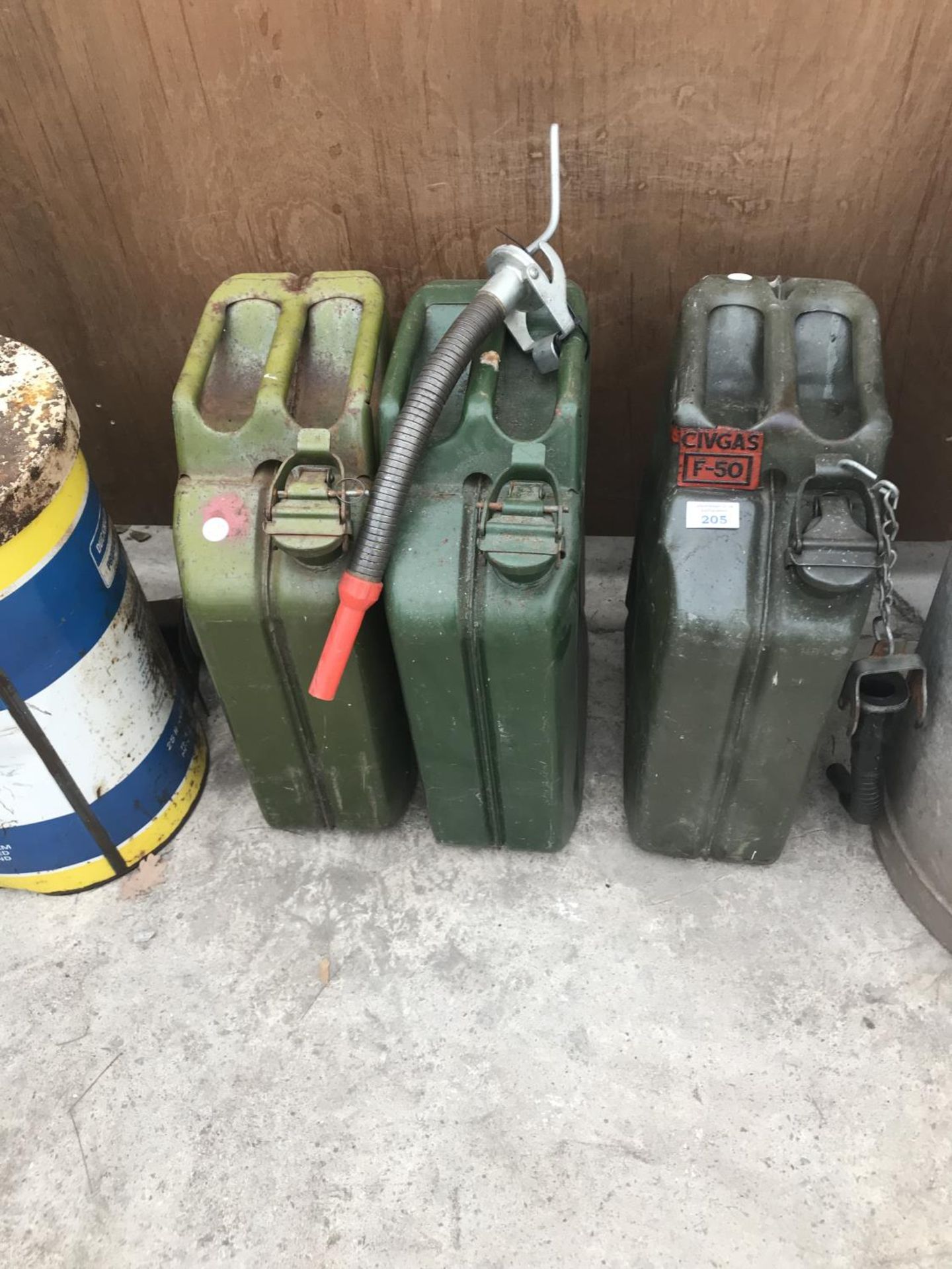 THREE VINTAGE METAL JERRY CANS