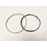 TWO SILVER CIRCULAR BANGLES