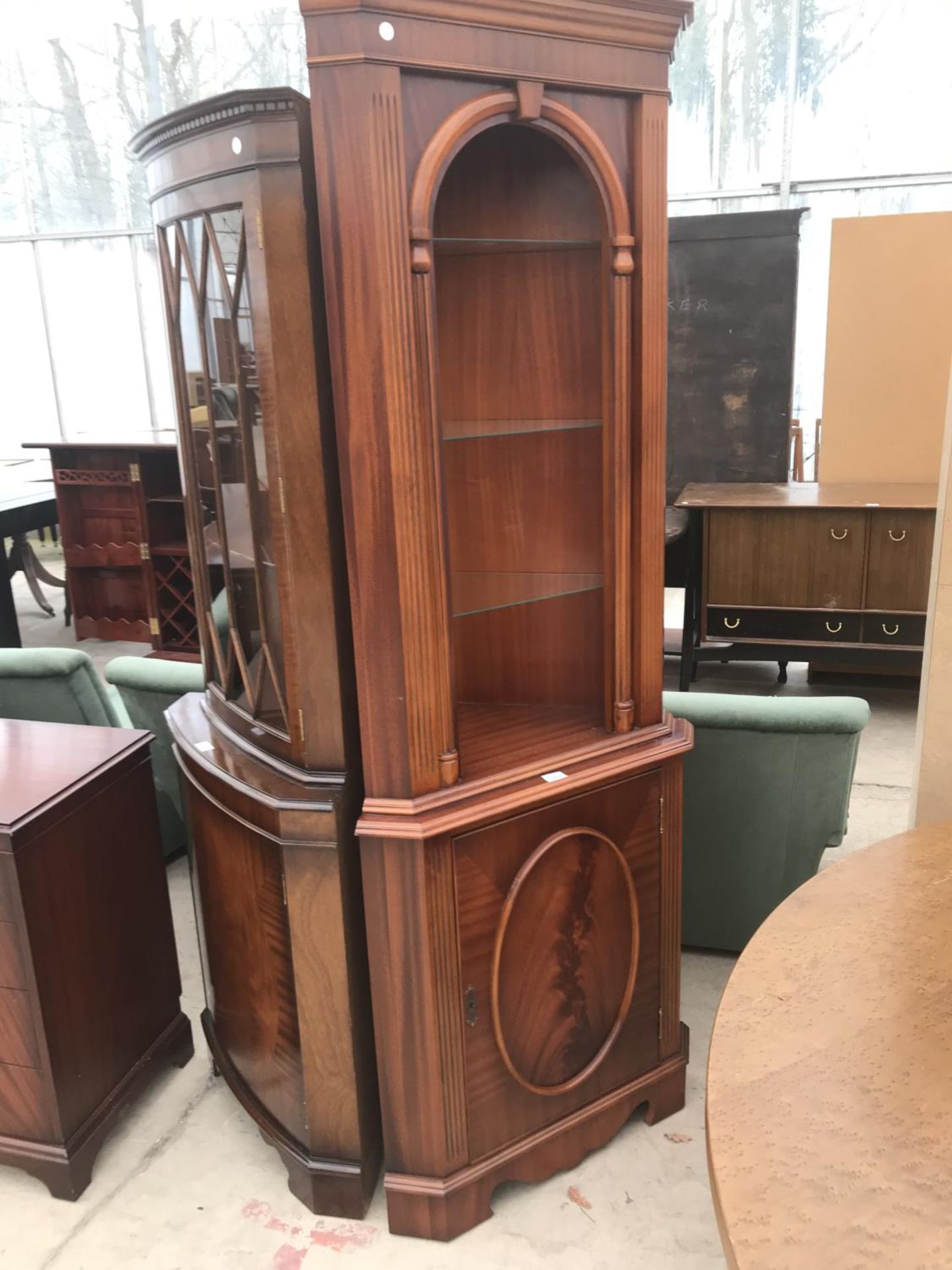A MAHOGANY CORNER CABINET WITH LOWER DOOR AND UPPER SHELVING
