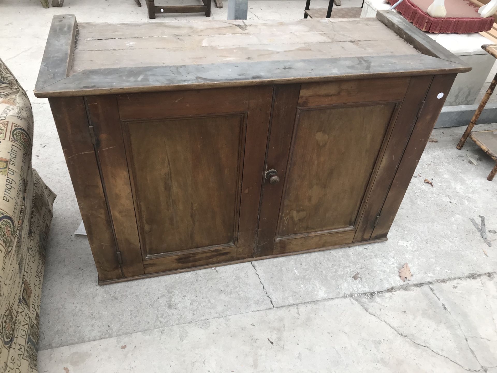 AN OAK CABINET WITH TWO DOORS