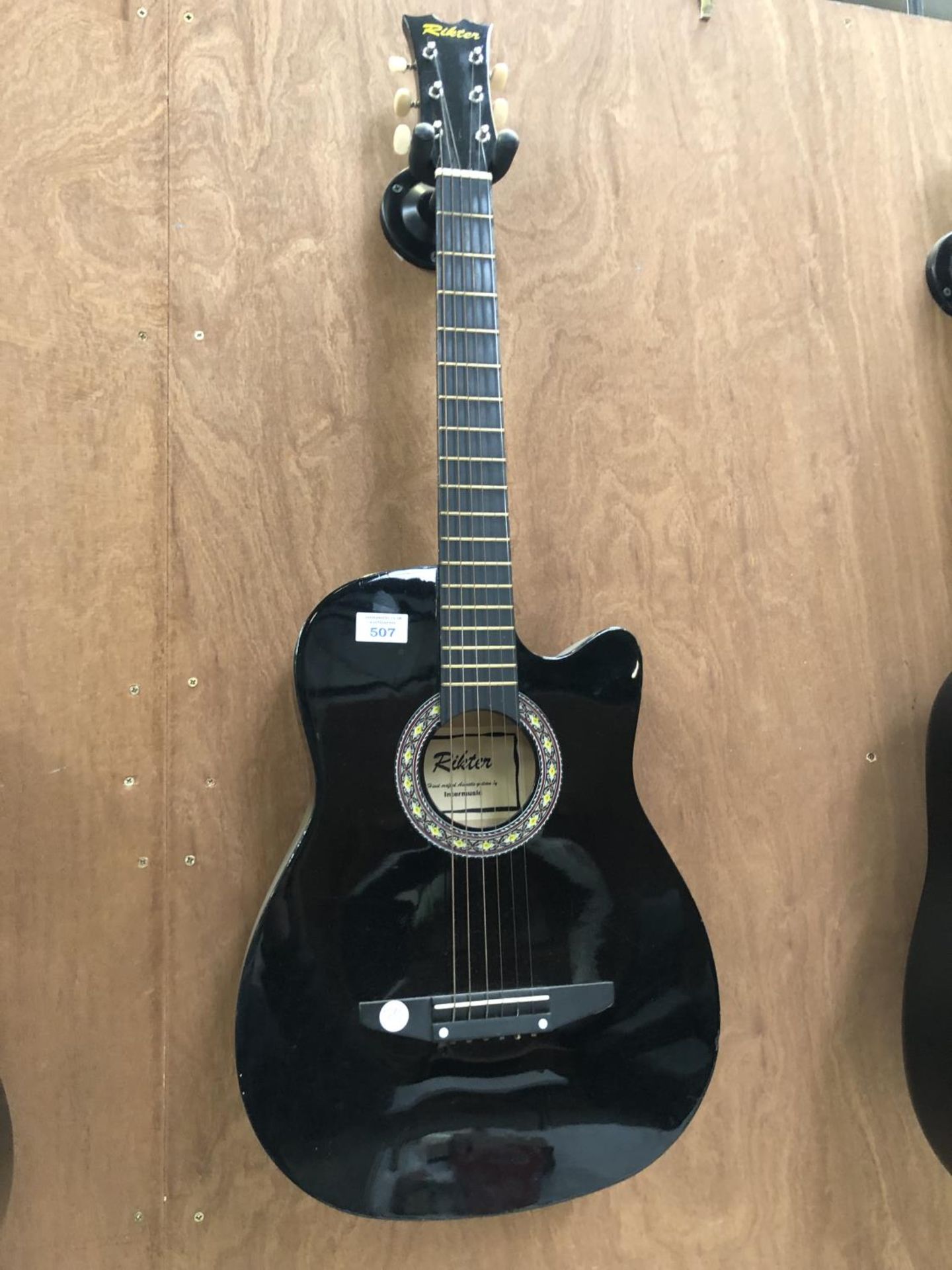 A BLACK 'RIKTER' ACOUSTIC GUITAR