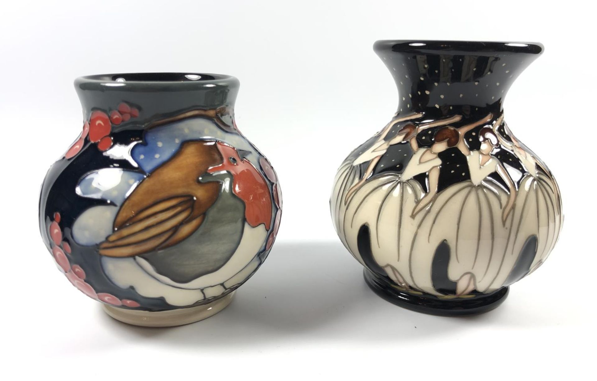 TWO MOORCROFT CHRISTMAS PATTERN VASES - A BRAVE SIR ROBIN AND NINE LADIES DANCING VASE, BOTH WITH