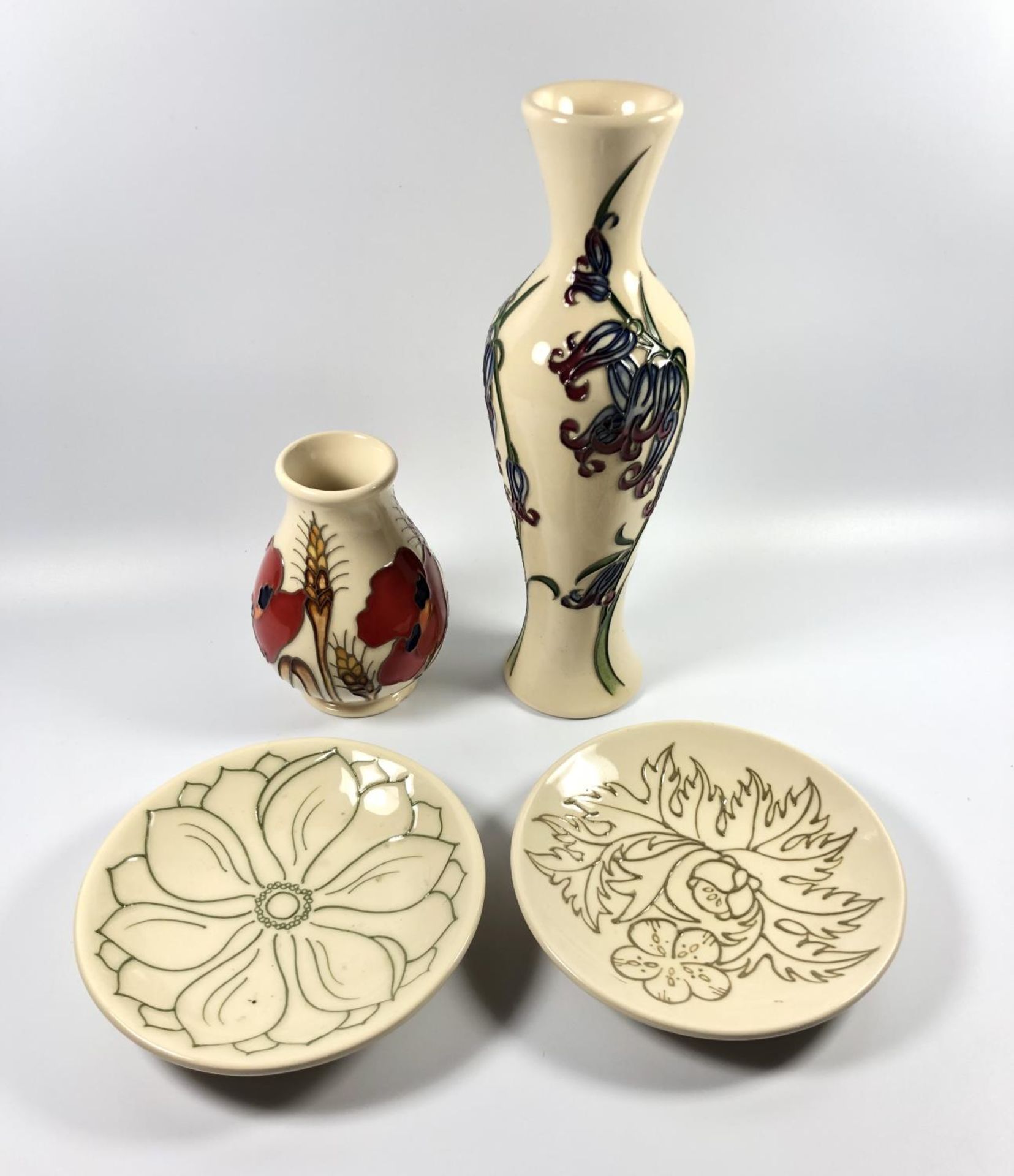 FOUR MOORCROFT POTTERY PIECES - TWO TUBE MASTER PIN DISHES, ONE BLUEBELL HARMONY VASE AND A