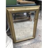 A MODERN FRAMED BEVELLED EDGE MIRROR