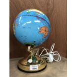 A MODERN LIGHT UP DESK GLOBE