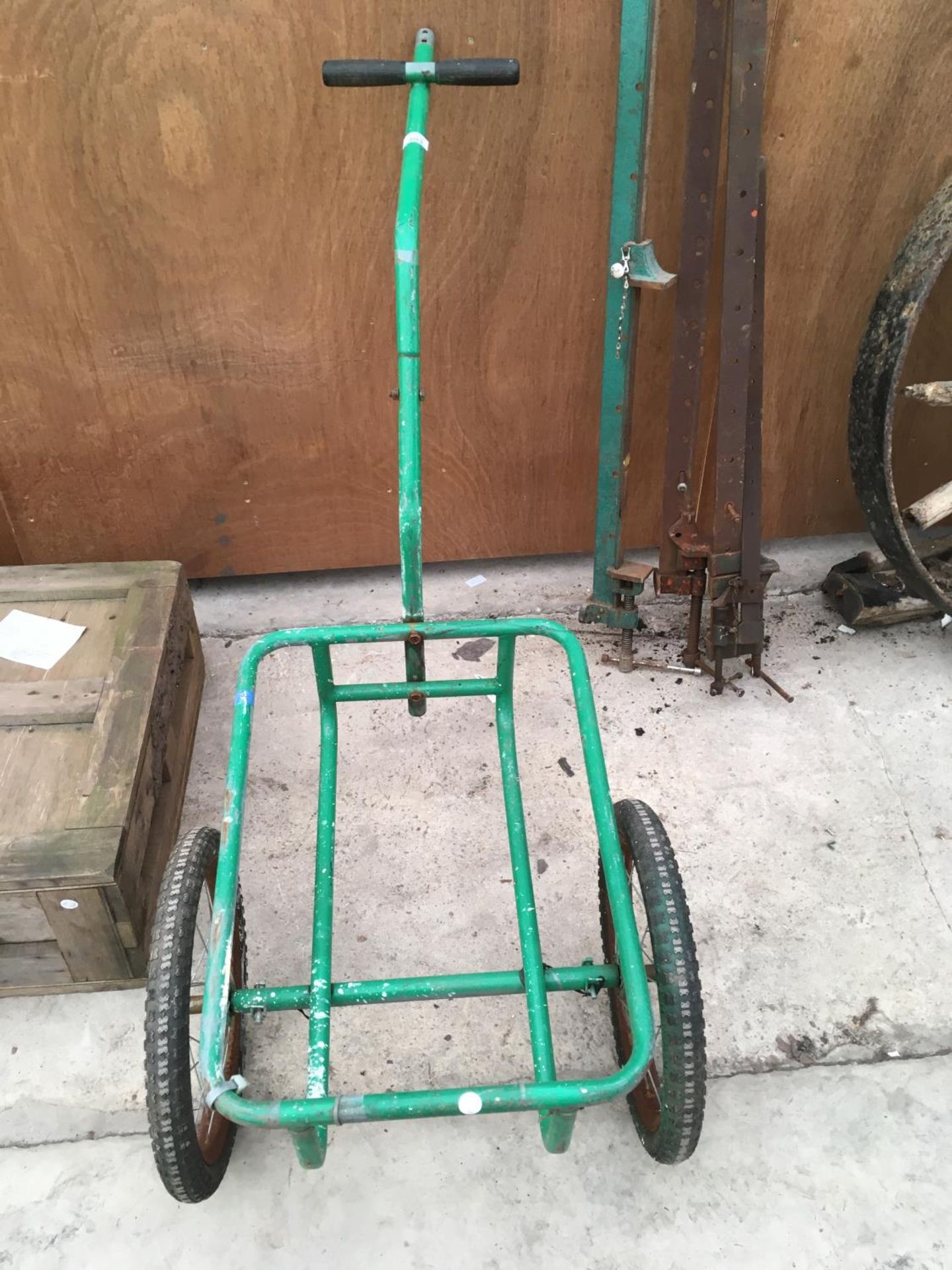 A GREEN METAL TWO WHEELED TROLLEY