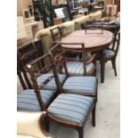 AN IMPRESSIVE BRASS INLAID MAHOGANY DINING TABLE WITH TWO EXTRA LEAVES TOGETHER WITH SIX UNUSUAL