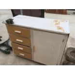 A RETRO KITCHEN CABINET WITH FOUR DRAWERS AND ONE DOOR AND A WH COLT ENGINEERS WILSON VICE LONDON