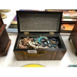 AN INLAID WOODEN BOX OF ASSORTED COSTUME JEWELLERY