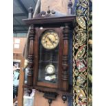 A MAHOGANY CASED VIENNA WALL CLOCK WITH PENDULUM