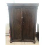 A PITCH PINE WARDROBE/ CABINET WITH TWO DOORS