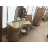 A LIMED MAHOGANY FOUR PIECE BEDROOM SUITE - A DRESSING TABLE WITH FIVE DRAWERS, TWO DOORS AND