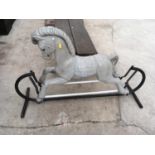 A VINTAGE PLASTIC ROCKING HORSE