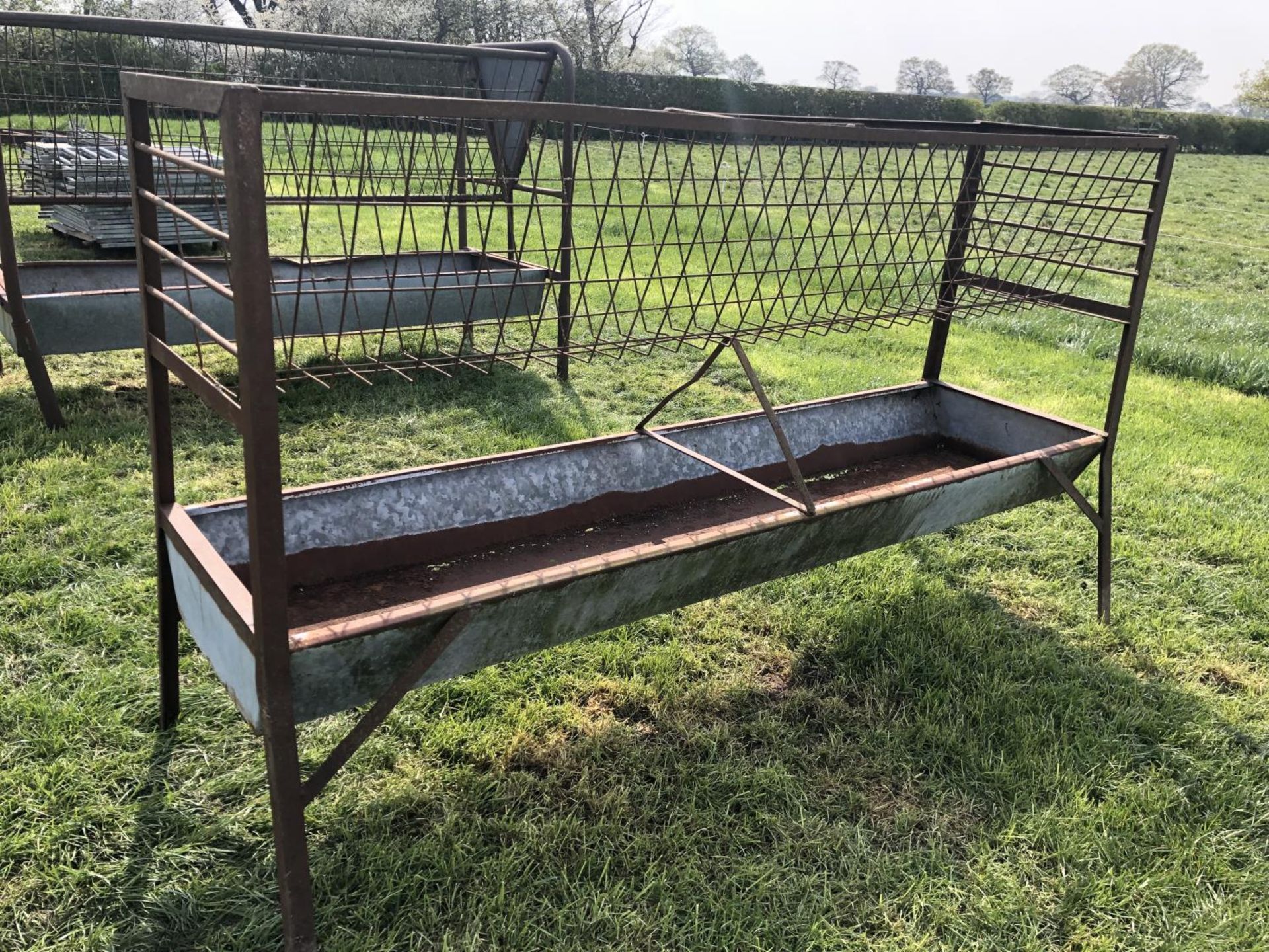 A LARGE GALVANISED FEED TROUGH WITH MANGER