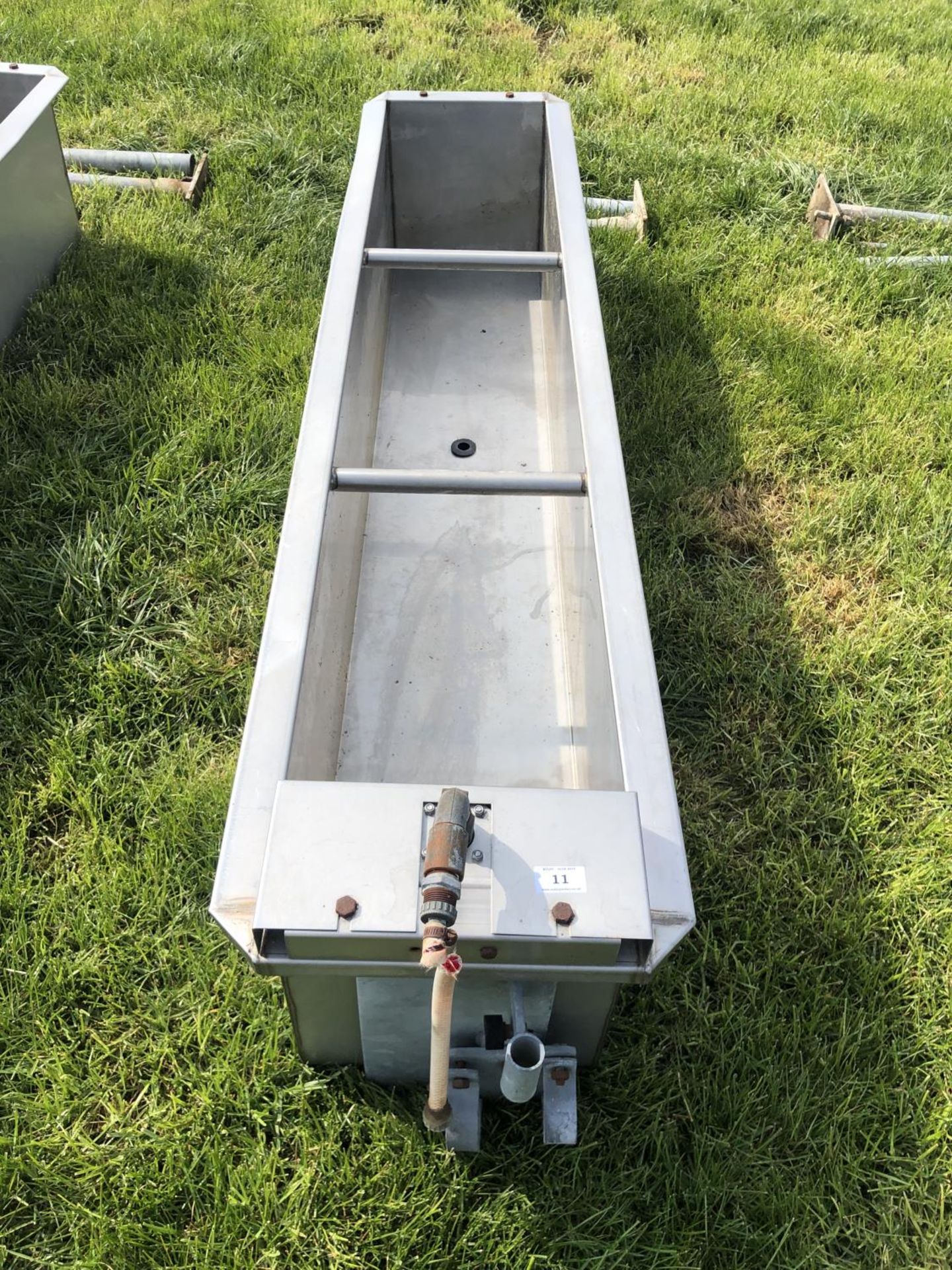 A STAINLESS STEEL WATER TROUGH