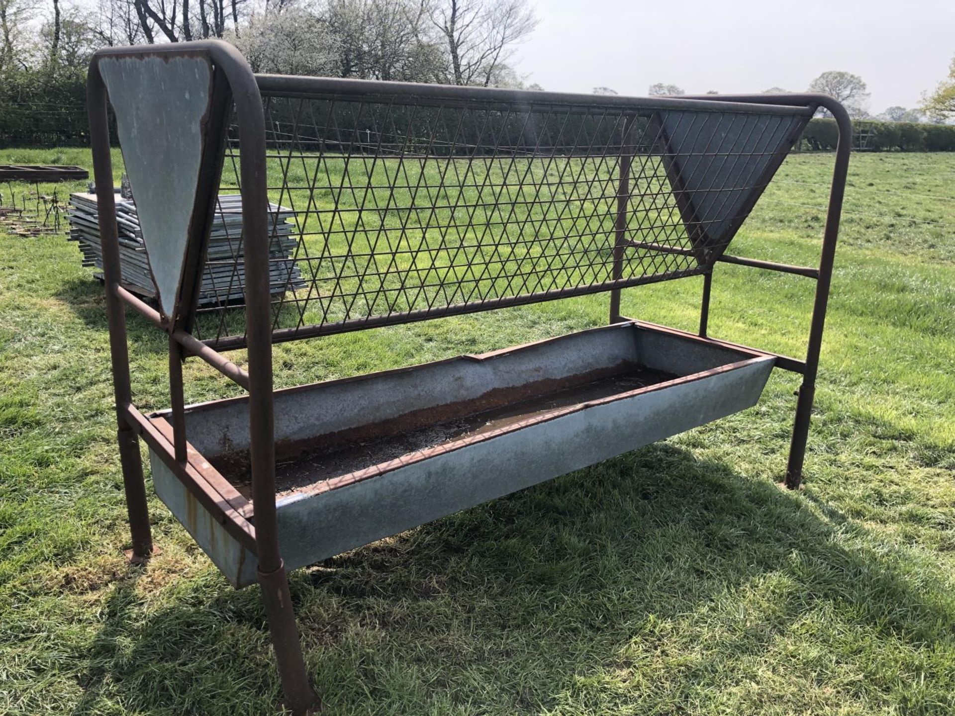 A LARGE GALVANISED FEED TROUGH WITH MANGER