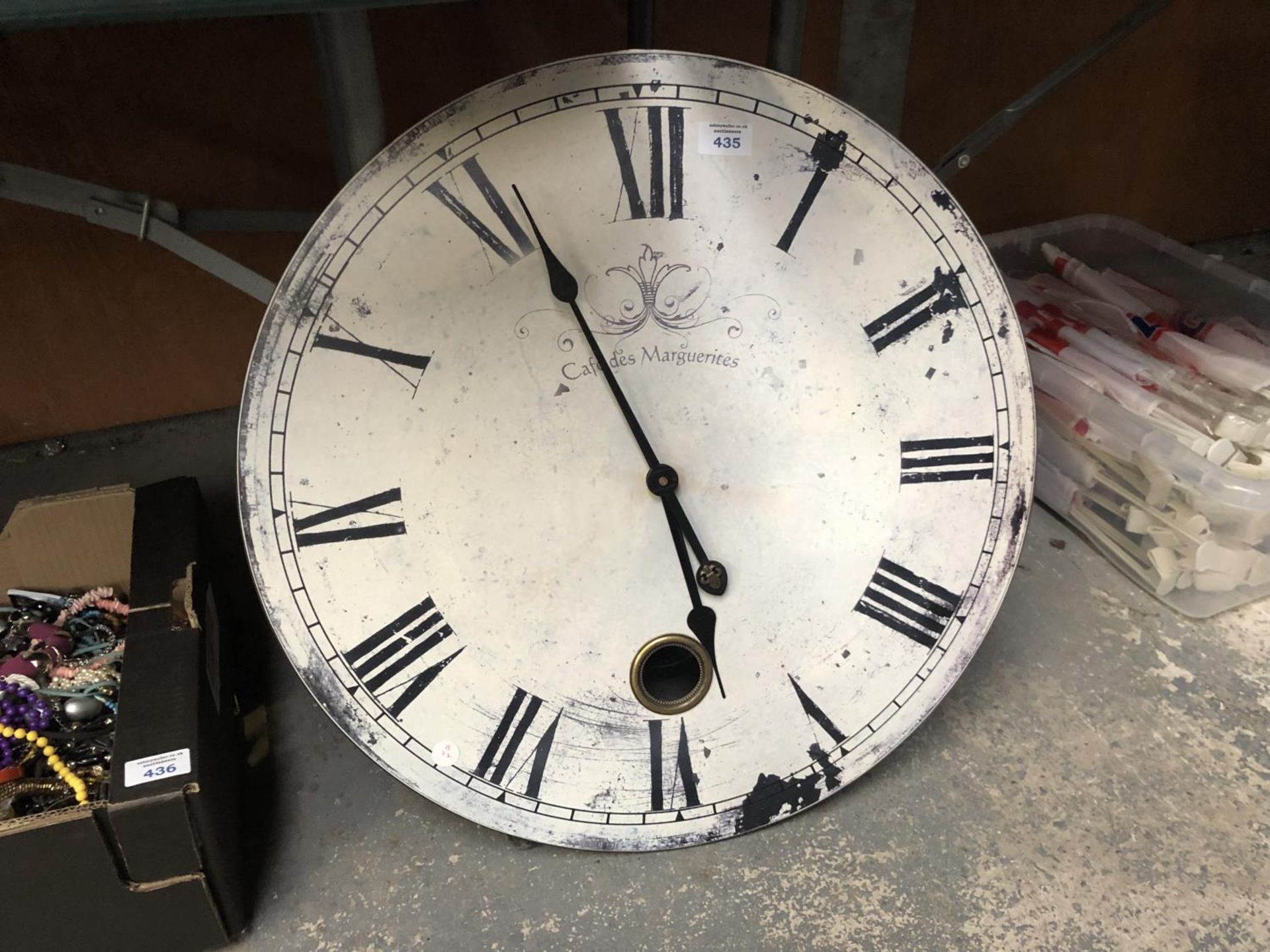 A LARGE MODERN WOODEN KITCHEN WALL CLOCK