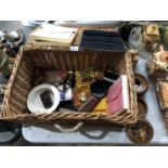 A WICKER BASKET CONTAINING VARIOUS ITEMS TO INCLUDE FLAPPING BIRD DESK TIDY ETC