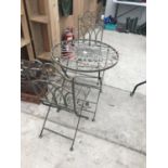 AN ORNATE METAL BISTRO STYLE TABLE WITH TWO MATCHING CHAIRS