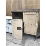 A TWO DOOR PINE CABINET WITH FOUR SHELVES IN NEED OF RESTORATION