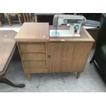 A NOVUM SEWING MACHINE IN A TEAK EFFECT CABINET