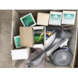 A BOX CONTAINING VARIOUS FISHING TACKLE - HOOKS, GROUND BAIT CASTERS ETC