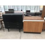 TWO CABINETS - ONE BLACK WITH FALL FRONT AND FOUR DRAWERS AND ONE TEAK EFFECT WITH WORKTOP