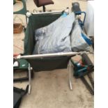 A FOLDING WHEELBARROW AND A TARPAULIN SHEET