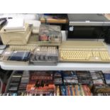 THREE ATARI 520ST AND A COLLECTION OF GAMES AND STORAGE BOXES