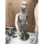 A VINTAGE MANNEQUIN OF A CHILD WITH GLASS EYES AND A METAL (RUSTED) STAND