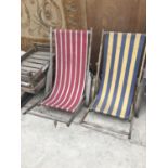 TWO VINTAGE WOODEN DECK CHAIRS WITH STRIPED CANVAS SEATS