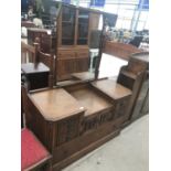 AN OAK DRESSING TABLE WITH TWO DOORS, FOUR SHORT AND ONE LONG DRAWER AND UPPER MIRROR