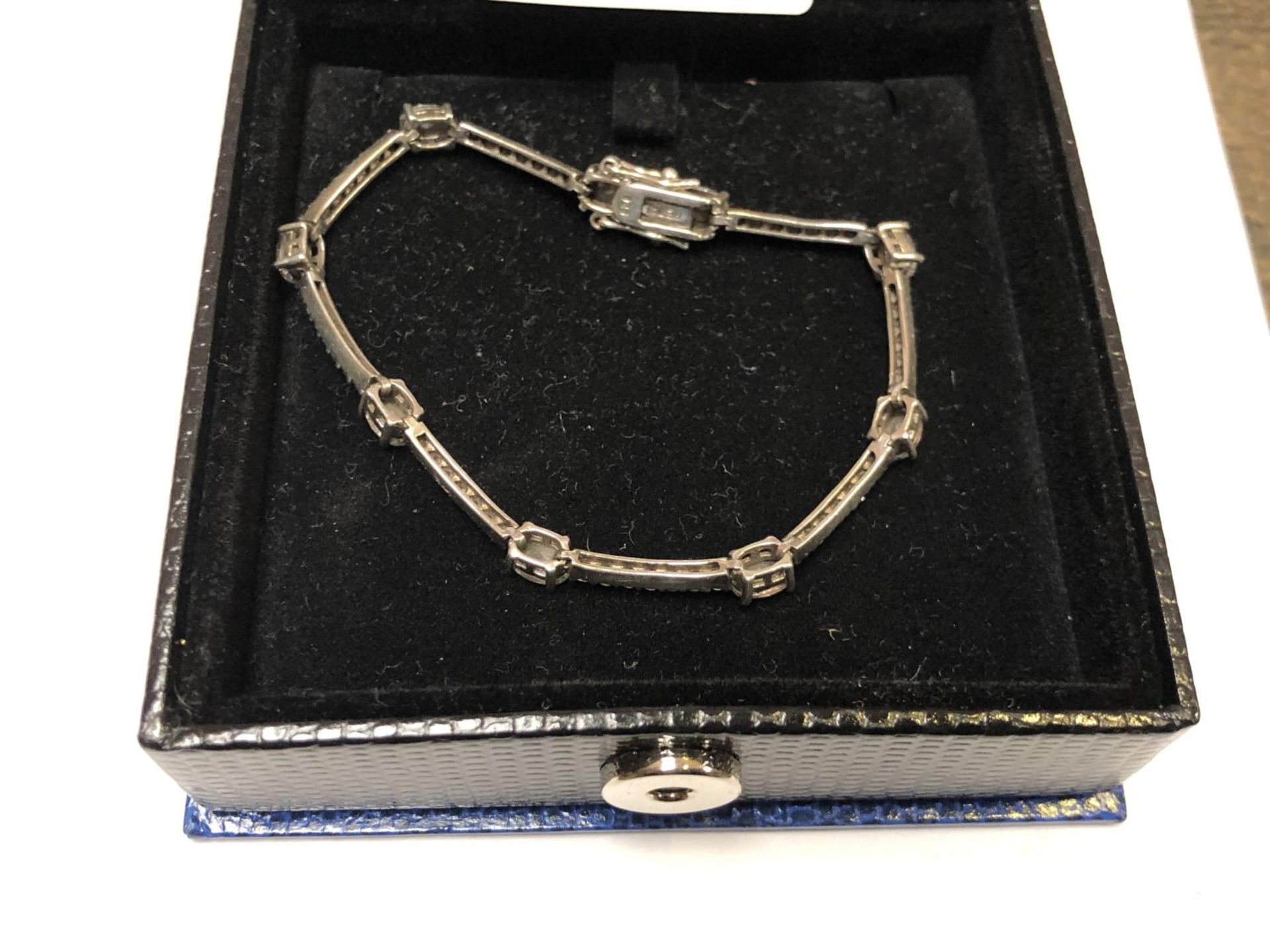 A LADIES BOXED SILVER AND CZ STONE BRACELET