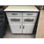 A RETRO KITCHEN CABINET WITH TWO DOORS, TWO DRAWERS AND TWO DROP DOWN DRAWER FRONTS