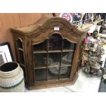 AN OAK CORNER DISPLAY CABINET