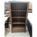 A PINE THREE TIER BOOKCASE WITH SINGLE LOWER DRAWER