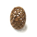 A CARVED WOODEN ACORN MODEL