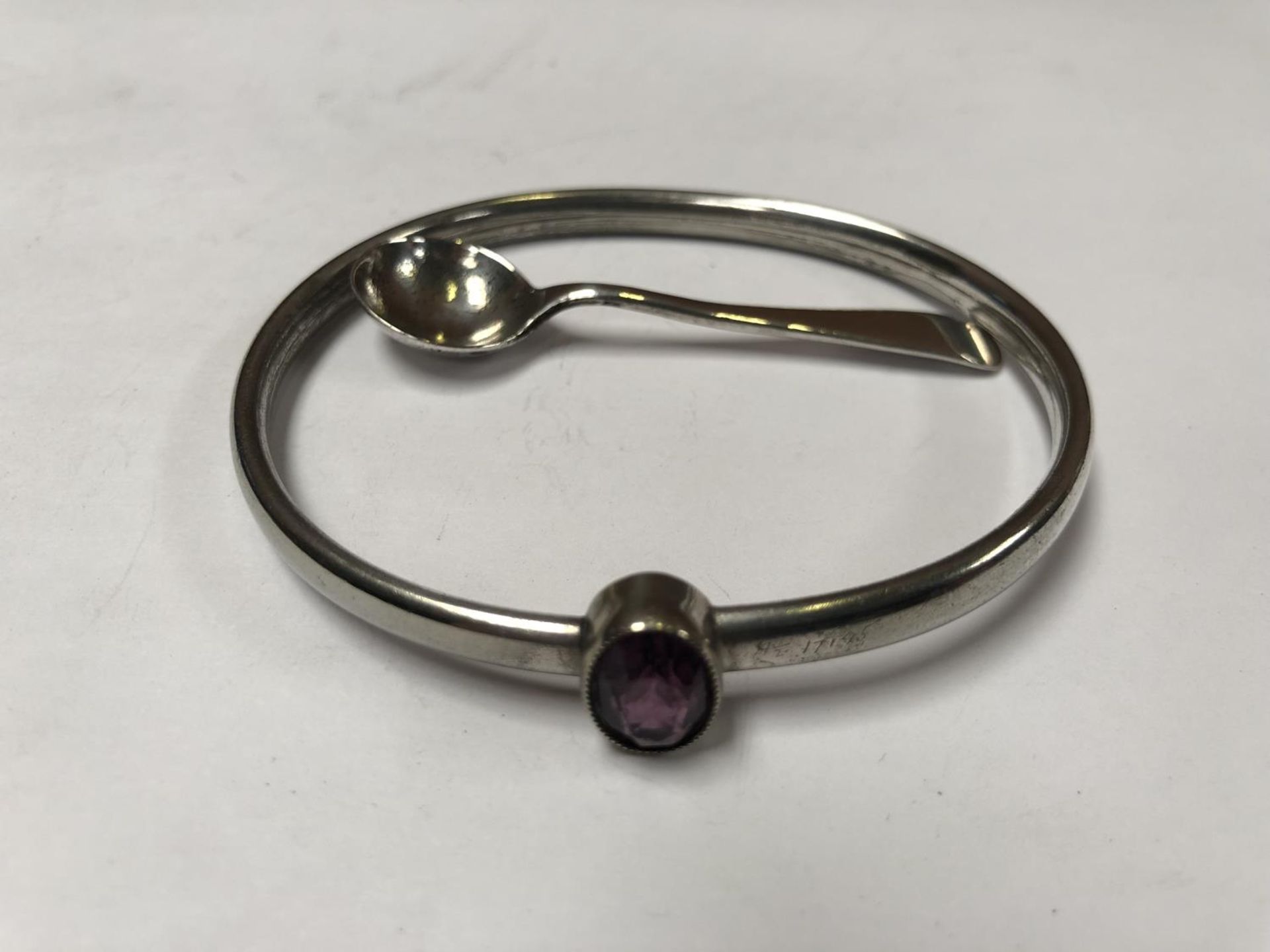 A LADIES SILVER BANGLE AND SPOON (2)