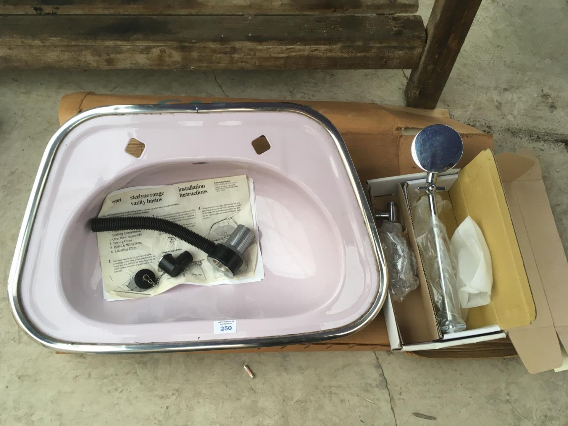 A BOXED STEELYNE RANGE LILAC VANITY BASIN WITH A BOXED SHOWER HEAD