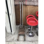 A VINTAGE WOODEN SLEDGE AND A PAIR OF GAZELLE METAL STILTS