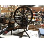 A LARGE VINTAGE STYLE WOODEN SPINNING WHEEL STOOL