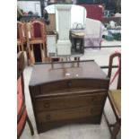 AN OAK DRESSING TABLE WITH THREE DRAWERS AND UNFRAMED MIRROR