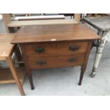 AN OAK CHEST OF TWO DRAWERS