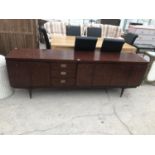 A GREAVES AND THOMAS LONG LOW MAHOGANY SIDEBOARD WITH SIX DOORS AND THREE DRAWERS