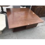 A LARGE SQUARE MODERN COFFEE TABLE