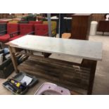 A WOODEN WORK BENCH WITH LOWER SHELF 183CM X 74CM