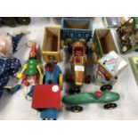 A MIXED GROUP OF WOODEN TOYS TO INCLUDE A TRAIN AND THREE CARRIAGES