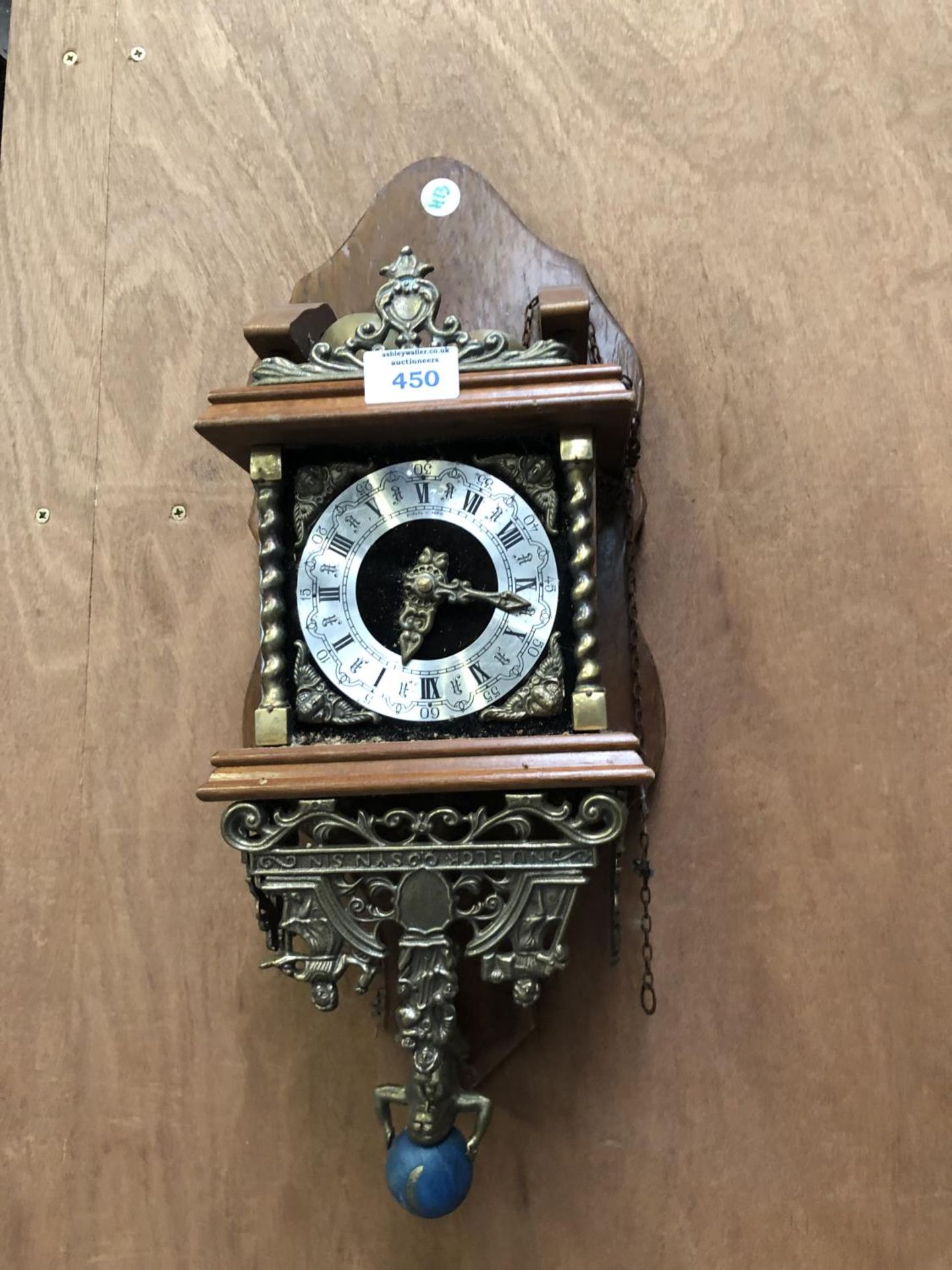 A MAHOGANY AND GILDED WALL CLOCK WITH SILVERISED DIAL
