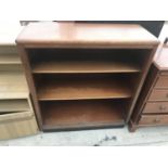 A MAHOGANY THREE TIER BOOKCASE