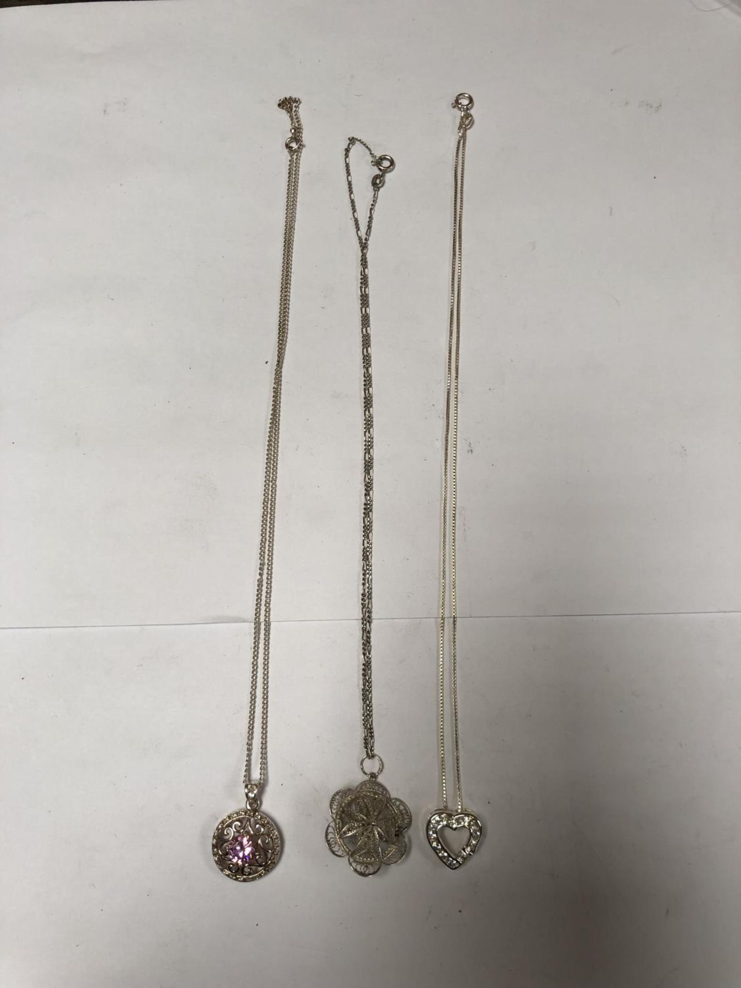 THREE LADIES ASSORTED SILVER NECKLACES